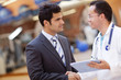 © Andres Rodriguez/Blend Images - Hispanic doctor and businessman shaking hands