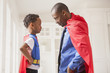 © Mike Kemp/Blend Images - Father and son playing superhero