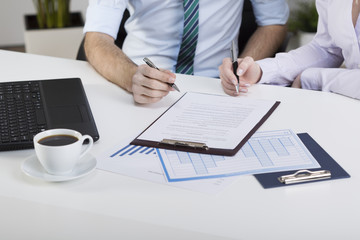 Business people signing contract