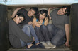 © Granger Wootz/Blend Images - Multi-ethnic group squeezed in small space