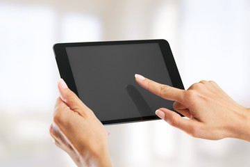 Poster - Tablet. Hands holding a tablet with isolated screen