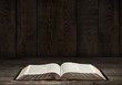 © BillionPhotos.com - Bible. Image of an old Holy Bible on wooden background in a dark