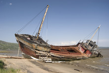 Full View Of A Shipwreck On The Beach