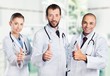 © BillionPhotos.com - Doctor. Portrait of happy doctors standing in a row
