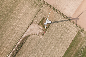 Wall Mural - aerial view of wind turbine on a field