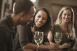 © John Fedele/Blend Images - Friends drinking wine together