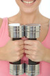 Healthy Young Woman Holding Two Dumb Bell Weights Together