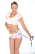 Healthy Young Woman Checking Her Weight Loss With a Tape Measure