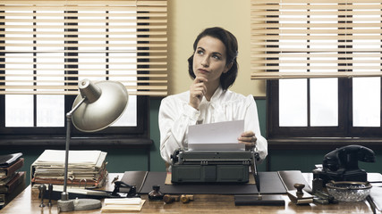 Pensive secretary with typewriter