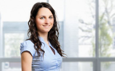 Wall Mural - Smiling young female manager portrait