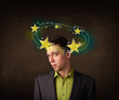 © ra2 studio - Young man with yellow stars circleing around his head