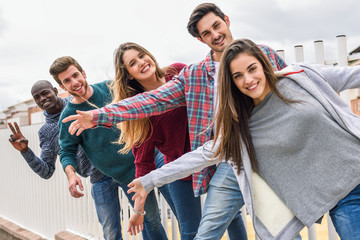 group of friends having fun together outdoors