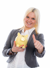 smiling young business woman with piggy bank and thumb up