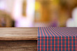 © Africa Studio - Empty wooden table with napkin and light background