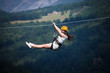 © zorandim75 - Adult woman on zip line