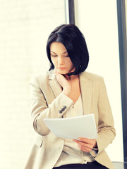 Poster - calm woman with documents