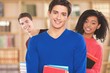 © BillionPhotos.com - Students. Group of university students at the library smiling