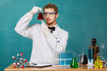 Poster - Chemistry. Woman with test tubes in a chemistry lab