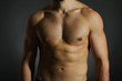 © Africa Studio - Muscle young man on dark background