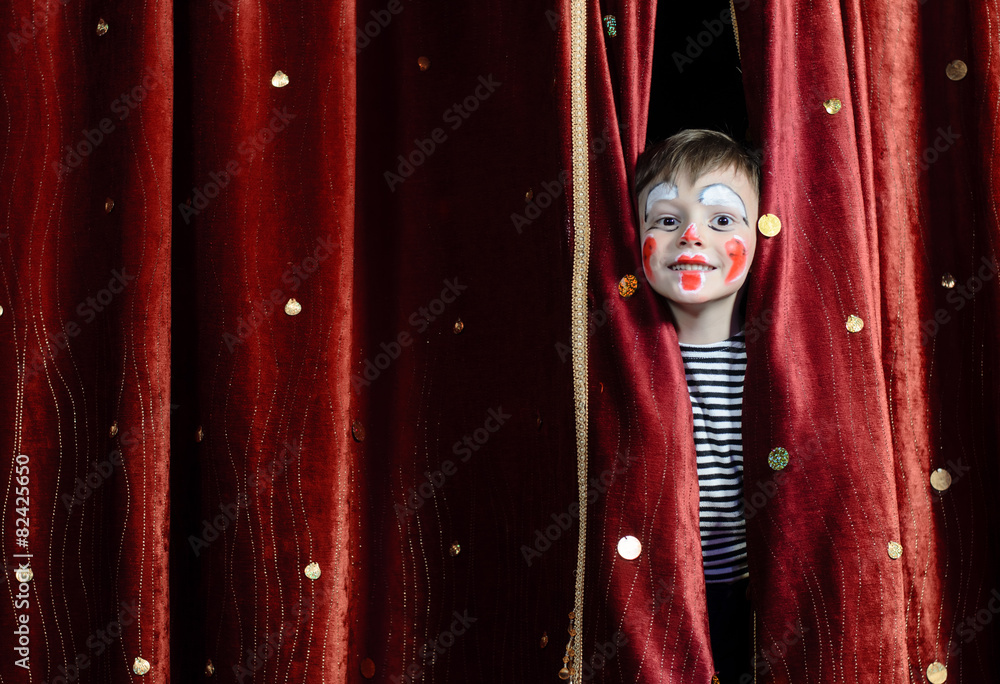 Boy Clown Peering Through Stage Curtains - obrazy, fototapety, plakaty 
