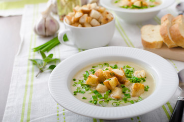 Wall Mural - Garlic soup with croutons, spring onions and chives