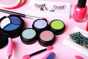 Set of decorative cosmetics on light colorful background