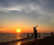 © apitsada - selfie with sunset on beach.