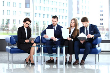 Canvas Print - Image of business partners discussing documents and ideas at mee