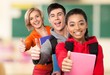 © BillionPhotos.com - High School Student. Group of smiling teens showing ok.
