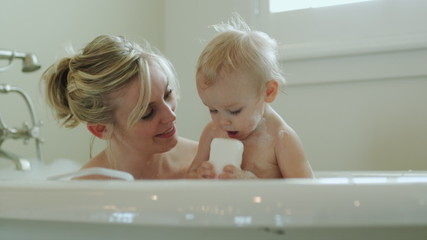 mother and baby taking a bath