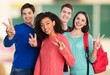 © BillionPhotos.com - Achievement. Happy Young students Showing Victory Sign