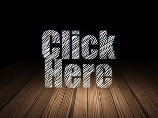 Web development concept: Click Here in grunge dark room
