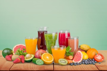 Wall Mural - Fruit. Glasses of fruit and vegetable juice with fruits on a