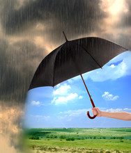 Black Umbrella In Hand Protecting Good Weather From Dark Clouds Of Rain