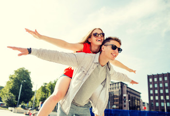 Wall Mural - smiling couple having fun in city