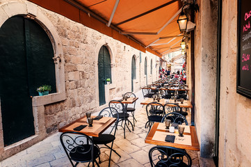 Restaurant terrace in old town of Dubrovnik in narrow streets