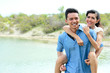 © Odua Images - romantic young man piggybacking his girlfriend