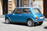 Fototapeta Miasto - Small blue car