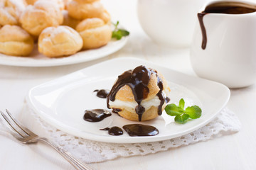 Wall Mural -  profiteroles with cream and chocolate sauce