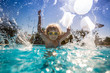 © Sunny studio - Child playing in swimming pool