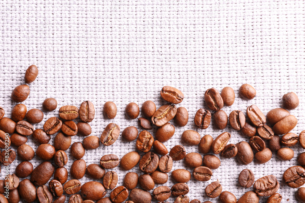 Frame of coffee beans on sackcloth background