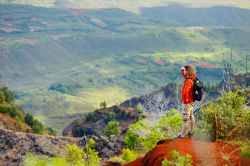 Poster - Young man enjoying a view into Waimea Canyon