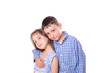 © emena - Brother sister hugging kcherz shoulder and smiling together on white background