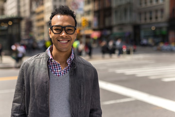 Poster - Young African Asian man in New York City smile face portrait