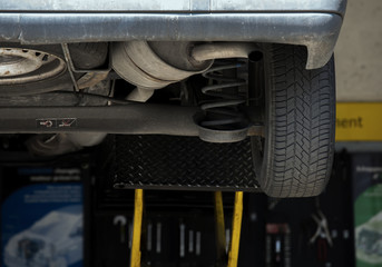 Close Up of shock absorbers replacement in a garage