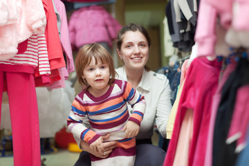 Poster -  child with mother at clothes shop