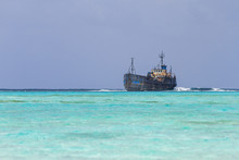 Wreck Aground Over Reef
