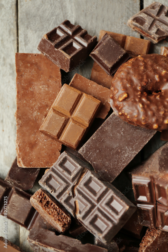 Set of chocolate on wooden table, closeup