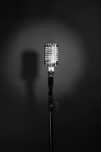 Retro Silver Microphone On Gray Background