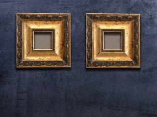 two gold frame black wall